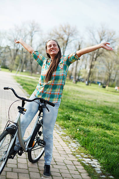 istock Happy young woman on a bicycle. 181855878