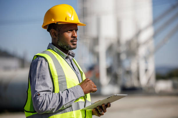 istock Portrait of male engineer using digital tablet while working factory industry workplace 1818561839