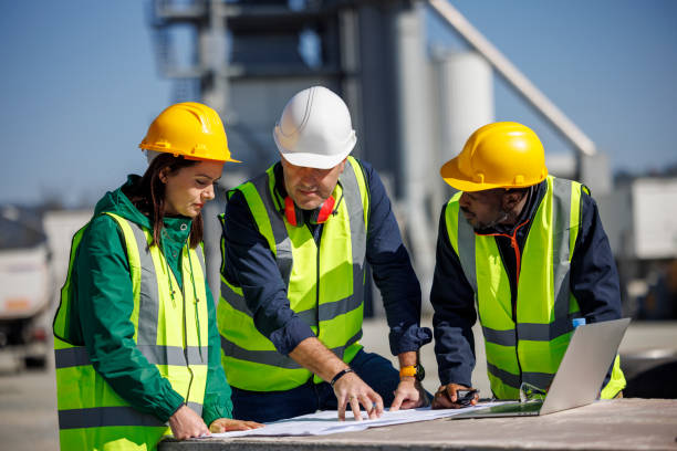 istock Team of engineers working at industrial facility 1818562189