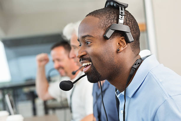 istock Diverse sports commentators in stadium press box during game 181856525