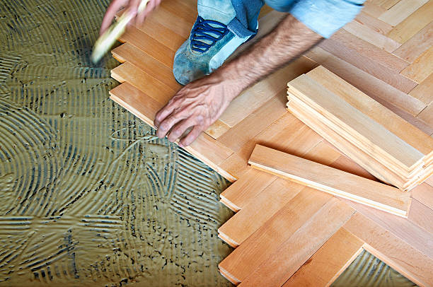 Installing parquet floor stock photo