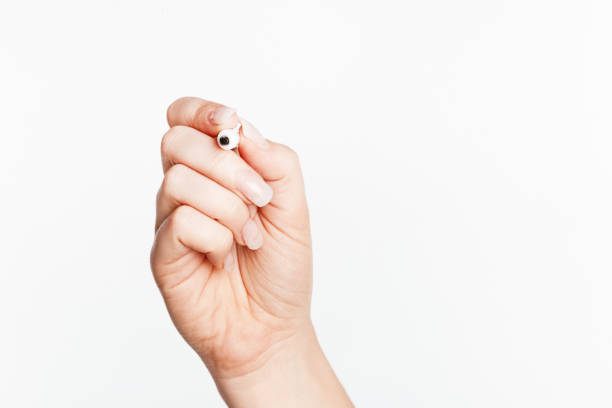 istock Woman's hand about to write with a the felt tip pen she is holding 1818567008