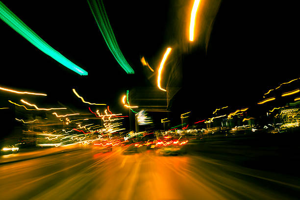 istock Highway driving at night with long exposure light trails 181856995