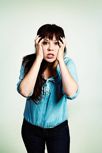 istock OMG! That's terrible! Pretty brunette gets bad news 181857082