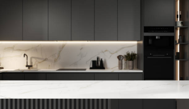 istock Mockup space on a luxury white marble tabletop with a blurred modern minimal gray kitchen 1818572872