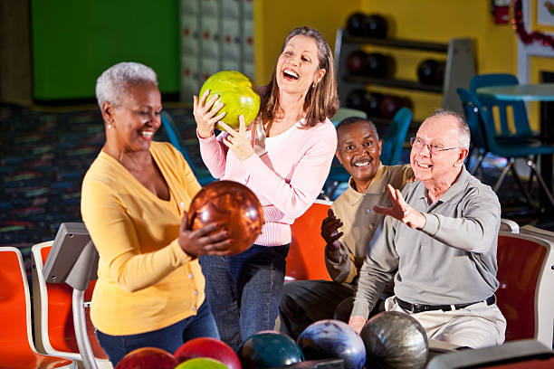 istock Seniors at bowling alley 181858406