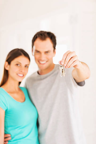 istock Young Couple With New House Keys 181859038