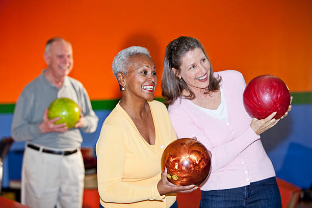 istock Friends at bowling alley 181859169