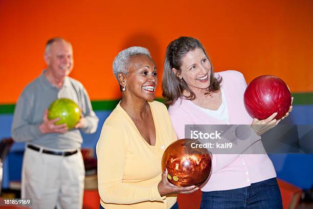 Friends At Bowling Alley Stock Photo - Download Image Now - 50-59 Years, 60-69 Years, Active Lifestyle