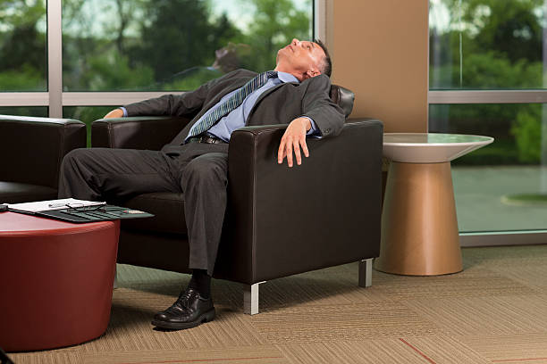 istock Businessman sitting back, looking up 181859295