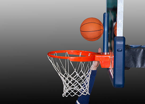 istock Basketball Hoop Hand and Ball on Gradient Gray Background 181859348