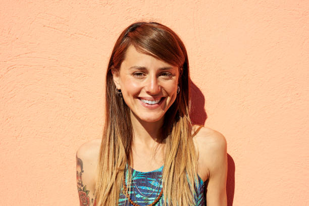 istock Cheerful woman smiling and looking at camera 1818593689