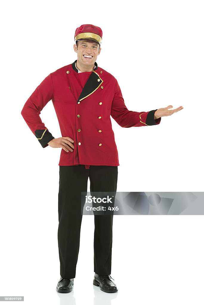Retrato de un feliz con servicio de valet Gesticular - Foto de stock de Botones libre de derechos