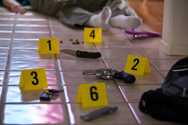 Crime scene with evidence markers and body stock photo