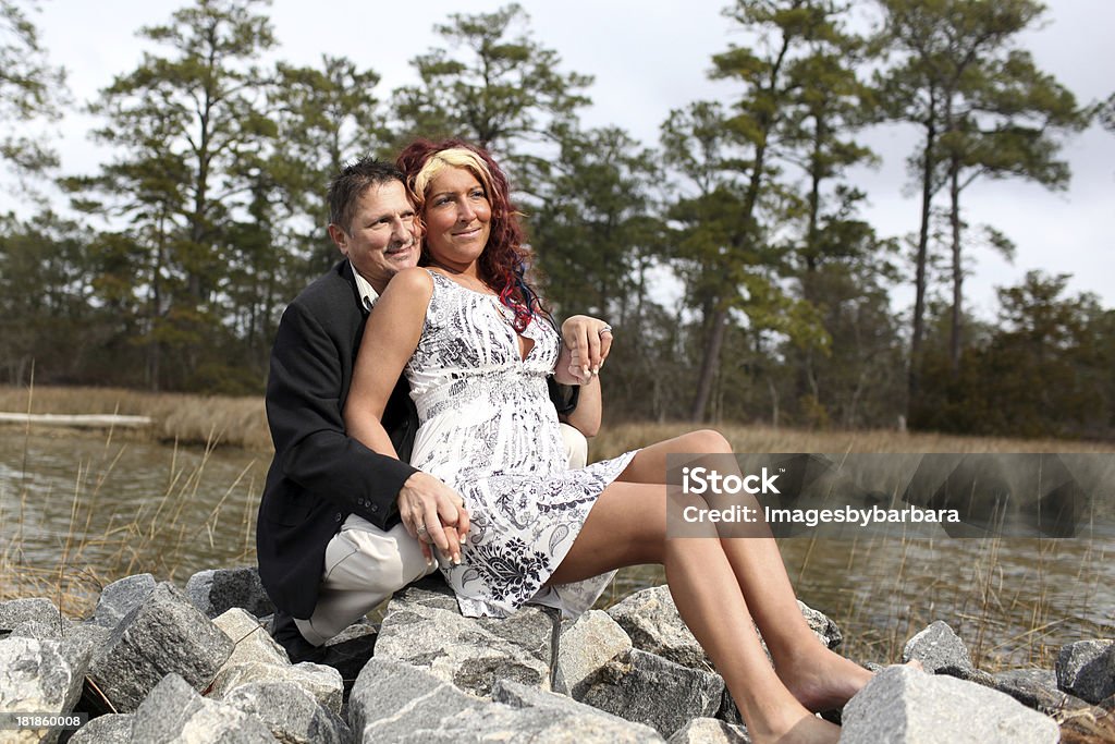 Couple in Love Couple embracing while sitting in a rural setting. 35-39 Years Stock Photo