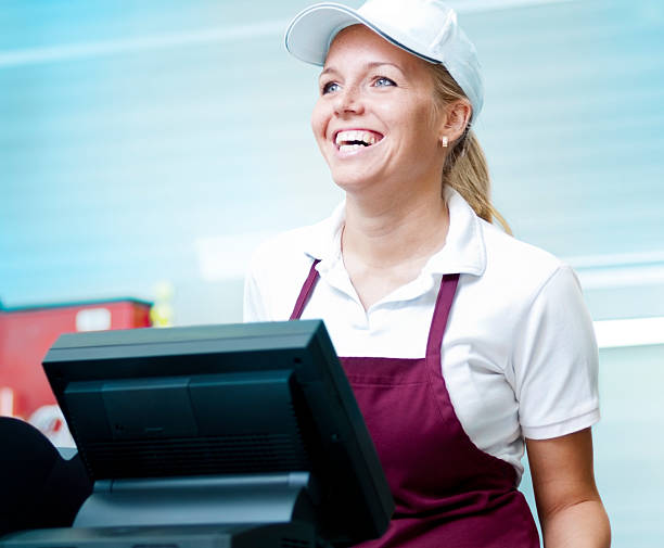 Waitress Waitress standing behind the counter.Please see some similar pictures from my portfolio: fast food uniform stock pictures, royalty-free photos & images