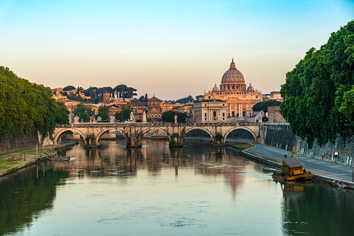 bridge, Ponte Sant Angelo reflected in the Tiber river .