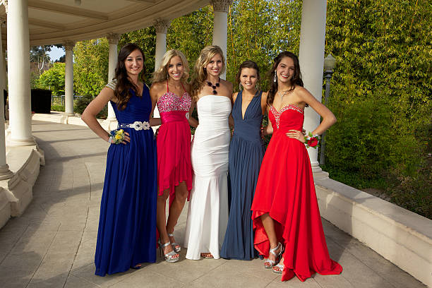 Beautiful Teenage Girls Going to the Prom Outdoors A group of five beautiful teenage girls going to the prom standing and looking at the camera. prom photos stock pictures, royalty-free photos & images