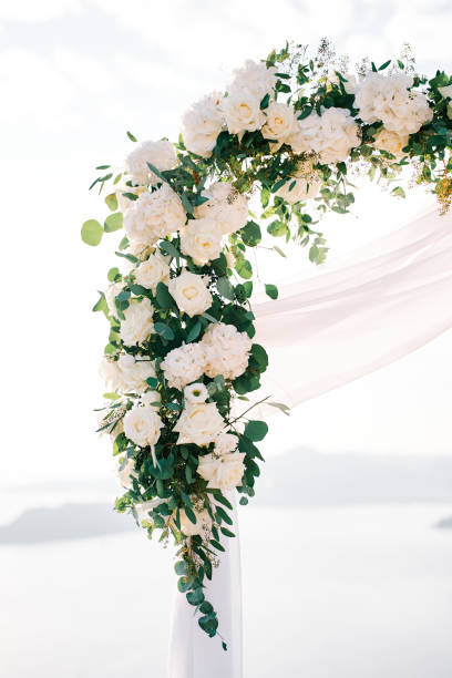 istock Wedding arch corner decorated with white flowers and fabric 1818607416