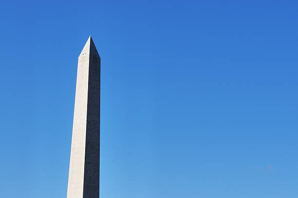istock Washington Monument Against a Clear Blue Sky 181861049