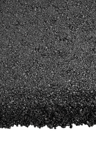 Photo of dark asphalted surface background isolated on white