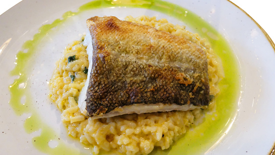 Fillet of roast cod served on a seafood risotto
