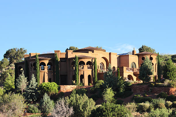 Villa Mansion Home Mediterranean Style "Luxury mansion built into the side of a hill with beautifully manicured desert landscape yard under a sunrise sky.  Pine Valley - Sedona, Arizona, 2013." nook architecture photos stock pictures, royalty-free photos & images