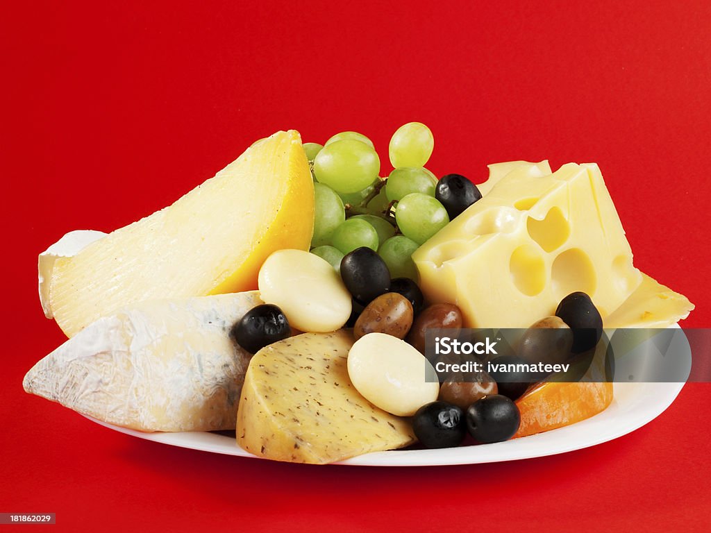 Cheese still life Variety of cheese with grapes, close up Alcohol - Drink Stock Photo