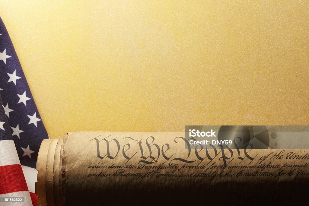 U.S. Constitutuion The U.S. Constitution siting on an old American flag. US Constitution Stock Photo