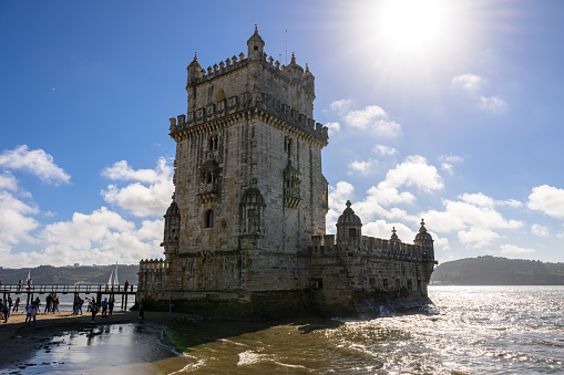 Lisbon, Portugal - Nov 12, 2023: Tourists wait in line to visit Belém Tower.