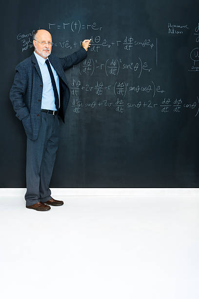 istock Science teacher writting at blackboard physics equation 181862366