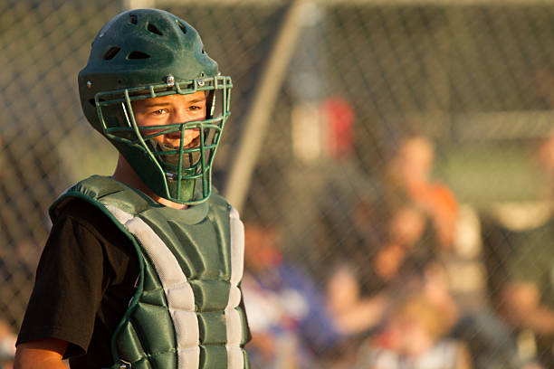 Baseball Catcher a catcher in a baseball game baseball helmet stock pictures, royalty-free photos & images