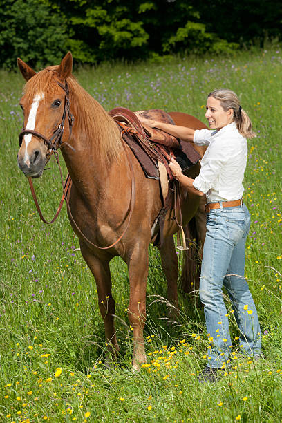 istock smiling woman horse saddle 181862846