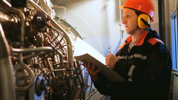 istock Industrial worker inspects turbine pre-engine start in industrial setting. Showcases industrial workers focus on safety, efficiency. Ideal for highlighting an industrial workers expertise. 1818635045