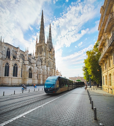 City tramway passing in front of Bordeaux Cathedral