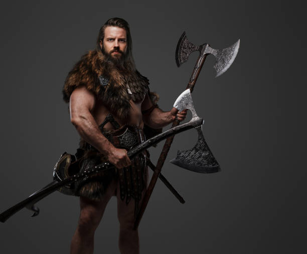 A fierce bearded Viking warrior in fur and light armor