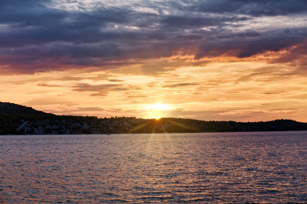 Dramatic sky over the Dalmatian coast at sunset, Croatia, Dalmatia, Adriatic Coast, Mediterranean Sea.
