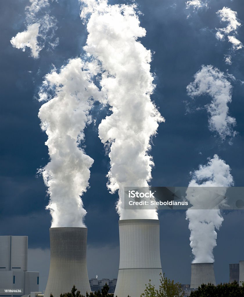 Coal-fired power plant and white steam against dark sky. Coal-fired power plant and white steam against dark sky.related: Blue Stock Photo