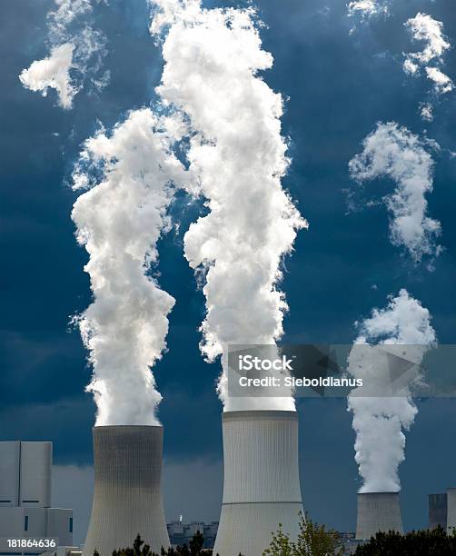 Coalfired Power Plant And White Steam Against Dark Sky Stock Photo - Download Image Now