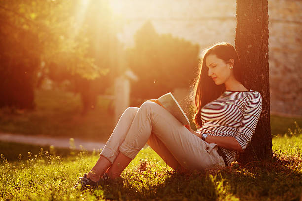 istock girl reading in nature 181864814