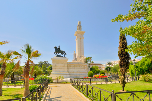 Just as titled, the Monument to the Constitution of 1812 in Cadiz in profile. Brilliant white marble with bronze statues and a central tower.