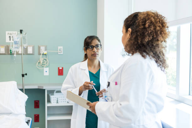 istock Female surgeons consult about a patient 1818650793