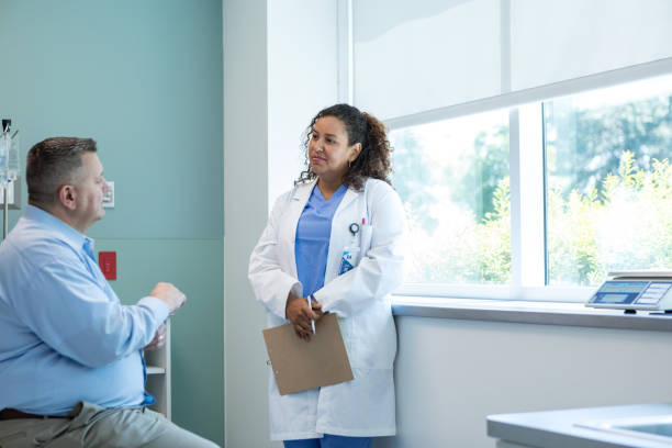 istock Male patient asks his doctor questions about his recovery process 1818651316