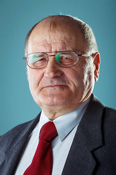 Senior man in a suit. Studio shot.