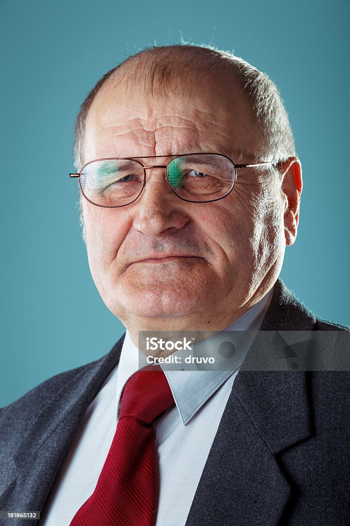 Portrait of Senior man in a suit Senior man in a suit. Studio shot. Senior Men Stock Photo