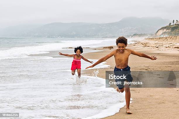 Playful Kids Running on The Beach