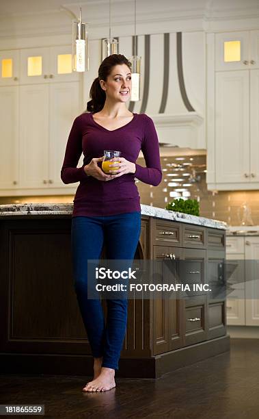 Young Woman In The Kitchen Stock Photo - Download Image Now - Adult, Adults Only, Apartment
