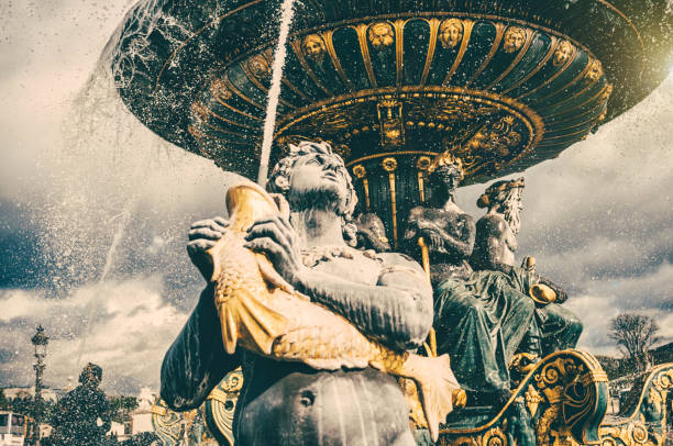 Fontaine des Mers on the Place de la Concorde in Paris. Toned picture with added grain.