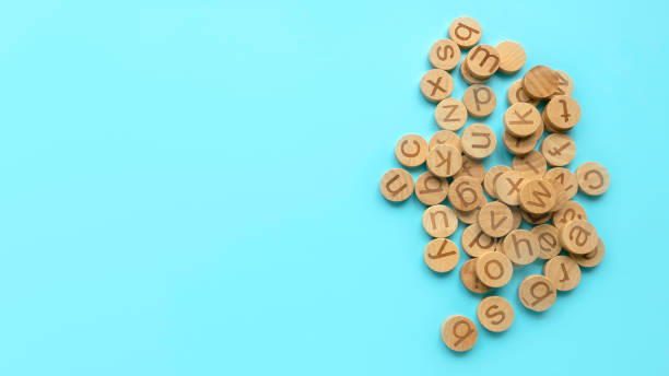 istock Wooden alphabet over a blue background. 1818658417