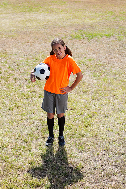 istock Girl playing soccer 181865860